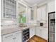 Kitchen area featuring a wine cooler, stainless steel appliances, and ample cabinet space at 601 Dorothy Dr, Charlotte, NC 28203