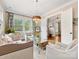 Comfortable living room with neutral tones, large windows, stylish curtains and ample seating at 601 Dorothy Dr, Charlotte, NC 28203