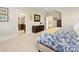 Bedroom featuring a view into ensuite bathroom, with dark wood furniture and light neutral carpet at 601 Dorothy Dr, Charlotte, NC 28203