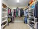 Walk-in closet featuring custom shelving and organization systems for clothes and accessories at 601 Dorothy Dr, Charlotte, NC 28203