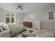 Bright bedroom features a ceiling fan, neutral walls and plush carpet at 625 N Alexander St, Charlotte, NC 28202