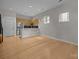 Open-concept living room with hardwood floors, bright windows, and modern kitchen view at 625 N Alexander St, Charlotte, NC 28202