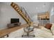 Inviting living room showcases hardwood floors, open staircase, and contemporary decor at 625 N Alexander St, Charlotte, NC 28202
