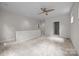 Versatile loft area offering neutral carpet, ample natural light, and access to a full bathroom at 625 N Alexander St, Charlotte, NC 28202