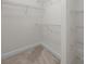A walk-in closet with wire shelves is ready for organization at 625 N Alexander St, Charlotte, NC 28202
