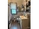Bathroom with white sink and gray tiled walls and floors at 6585 White St, Kershaw, SC 29067