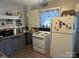 Functional kitchen featuring appliances, granite countertops, and ample cabinet space at 6585 White St, Kershaw, SC 29067
