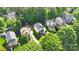 An aerial view of the home and its neighborhood, including the lush, mature landscaping and private backyards at 7814 Knox Ridge Rd, Huntersville, NC 28078