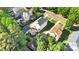 Aerial view of neighborhood, showcasing backyard patio, detached garage, and well-maintained landscaping at 7814 Knox Ridge Rd, Huntersville, NC 28078
