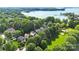Picturesque aerial view showcasing the lakeside community and the sparkling water, creating a serene and inviting atmosphere at 7814 Knox Ridge Rd, Huntersville, NC 28078