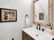 Charming bathroom features framed mirror, quartz countertop, and stylish dark faucet with matching hardware at 7814 Knox Ridge Rd, Huntersville, NC 28078