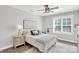 Bedroom featuring carpet flooring, a ceiling fan, window with shutters and a nightstand at 7814 Knox Ridge Rd, Huntersville, NC 28078