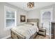 Bedroom featuring carpet flooring, neutral walls and a large window with shutters at 7814 Knox Ridge Rd, Huntersville, NC 28078