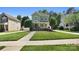 Charming two-story home with a beautifully landscaped front yard and inviting walkway at 7814 Knox Ridge Rd, Huntersville, NC 28078