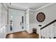 Bright foyer featuring wood floors, decorative wainscoting and eye-catching medallion wall decor at 7814 Knox Ridge Rd, Huntersville, NC 28078
