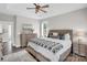 Bright main bedroom featuring neutral walls and bedding plus a large window with shutters at 7814 Knox Ridge Rd, Huntersville, NC 28078