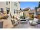 Outdoor patio featuring a stone fire pit and seating at 7814 Knox Ridge Rd, Huntersville, NC 28078
