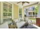 Covered porch with a ceiling fan and furniture with plush cushions at 7814 Knox Ridge Rd, Huntersville, NC 28078
