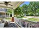 Covered front porch with cushioned seating and landscaping views at 7814 Knox Ridge Rd, Huntersville, NC 28078