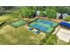 Aerial view of community tennis and basketball courts, sand volleyball, playground surrounded by green space at 7814 Knox Ridge Rd, Huntersville, NC 28078