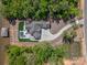 Overhead view of lakefront home and dock with a sprawling driveway and lush landscaping at 8044 Edgewater Dr # 100, Norwood, NC 28128