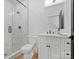 Sleek bathroom featuring a glass shower with marble tile and modern fixtures at 8044 Edgewater Dr # 100, Norwood, NC 28128