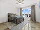 Comfortable bedroom boasts lake views, natural light, and a relaxing atmosphere at 8044 Edgewater Dr # 100, Norwood, NC 28128