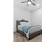 Clean bedroom with a cozy bed, ceiling fan, and a modern, comfortable design at 8044 Edgewater Dr # 100, Norwood, NC 28128