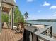 Enjoy the lake view from this spacious deck, complete with a grill and seating area at 8044 Edgewater Dr # 100, Norwood, NC 28128