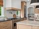 Bright kitchen boasts a spacious island, stainless steel appliances, and light wood cabinetry at 8044 Edgewater Dr # 100, Norwood, NC 28128