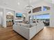 Bright living area with high ceilings, fireplace, and doors that lead to a lake view at 8044 Edgewater Dr # 100, Norwood, NC 28128