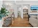 Open-concept living room with hardwood floors, modern lighting, and stylish decor at 8044 Edgewater Dr # 100, Norwood, NC 28128