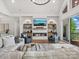 Cozy living area with a fireplace, built-in shelving, and comfortable seating at 8044 Edgewater Dr # 100, Norwood, NC 28128