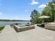 Modern pool and spa overlooking the lake with stylish lounge furniture and landscaping at 8044 Edgewater Dr # 100, Norwood, NC 28128