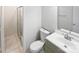 Clean bathroom featuring a modern vanity, toilet, and glass-enclosed shower for a fresh and updated look at 8600 Eaglewind Dr, Charlotte, NC 28212