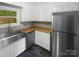 This kitchen features butcher block counters, stainless steel appliances, and white cabinets at 8600 Eaglewind Dr, Charlotte, NC 28212
