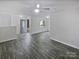 Bright living room with ample natural light, modern flooring, and a welcoming entrance at 8600 Eaglewind Dr, Charlotte, NC 28212