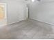 Main bedroom features neutral walls, carpet floor, and an ensuite bathroom with walk in shower at 8600 Eaglewind Dr, Charlotte, NC 28212