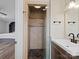 Modern bathroom featuring tiled shower with glass door and granite vanity at 895 Furnace Rd, Iron Station, NC 28080