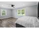 Bright and airy bedroom featuring two windows and new luxury vinyl flooring at 895 Furnace Rd, Iron Station, NC 28080