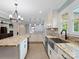 Bright kitchen with granite countertops, stainless steel sink, and modern appliances at 895 Furnace Rd, Iron Station, NC 28080