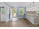 Bright kitchen with granite counters and door to porch at 895 Furnace Rd, Iron Station, NC 28080