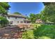Expansive backyard with a patio, deck, and a peaceful setting with mature trees at 9209 Cameron Wood Dr, Charlotte, NC 28210