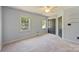 This bedroom offers natural light from two windows and ample closet space at 9209 Cameron Wood Dr, Charlotte, NC 28210