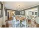 Spacious dining area with modern decor, chandelier lighting, and easy access to the living room at 9209 Cameron Wood Dr, Charlotte, NC 28210