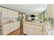 A bright and airy kitchen featuring granite countertops, stainless appliances, and an open view to the living area at 9209 Cameron Wood Dr, Charlotte, NC 28210