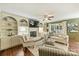 Inviting living room features custom built-ins, a fireplace, and seamless flow to the kitchen and dining area at 9209 Cameron Wood Dr, Charlotte, NC 28210