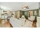 Inviting living room featuring hardwood floors, modern furniture, and an open layout connecting to the kitchen at 9209 Cameron Wood Dr, Charlotte, NC 28210