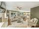Comfortable living room with a fireplace, hardwood floors, and large windows offering plenty of natural light at 9209 Cameron Wood Dr, Charlotte, NC 28210