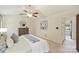Cozy main bedroom with a ceiling fan, neutral tones, and a view of an adjacent room, offering a calming atmosphere at 9209 Cameron Wood Dr, Charlotte, NC 28210